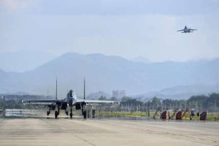 In this photo released by China's Xinhua News Agency, air force and naval aviation corps of the Eastern Theater Command of the Chinese People's Liberation Army (PLA) fly planes at an unspecified location in China, Thursday, Aug. 4, 2022. AP/RSS Photo